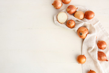 Fresh raw onion on white table