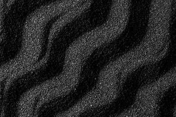 Black sand dunes background. Bump trace. Creative sand relief.