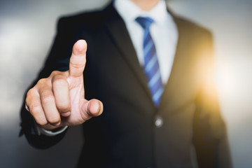 Businessman pressing button on virtual screens, Space for text.