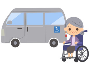 介護車と車いすに乗った老人