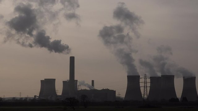Industrial landscape in the north of England with chimneys and turbines UK 4K
