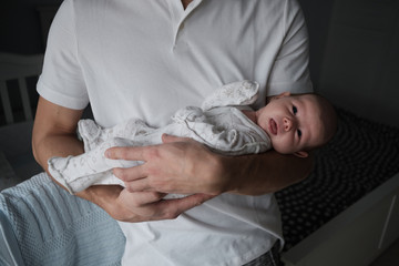 Home portrait of a newborn baby with dad