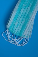 Medical masks. Virus protective masks  on a bright blue background. Pandemic and epidemic...