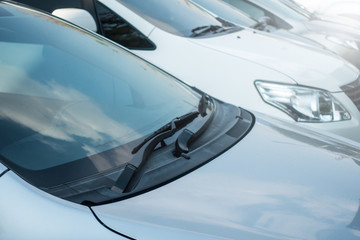 Fototapeta premium Close-up front glass, window of the car and the side left mirror on the street
