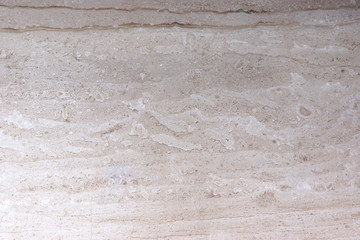 Natural stone with a beautiful pattern for interior design in beige color is called Breccia Sarda marble