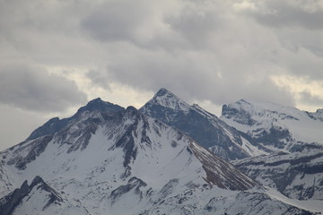 Snowy mountains in the clouds