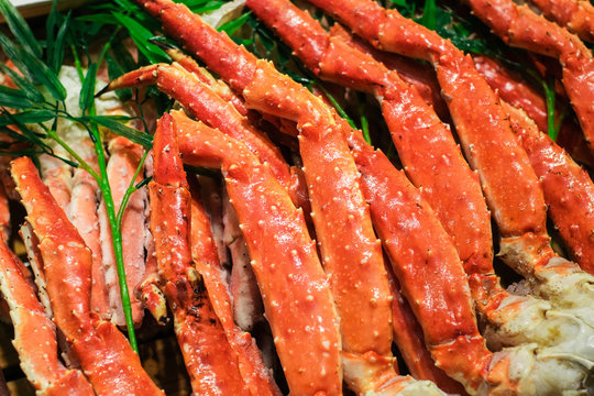Close up big giant King crab legs selling in market , food and travel concept.