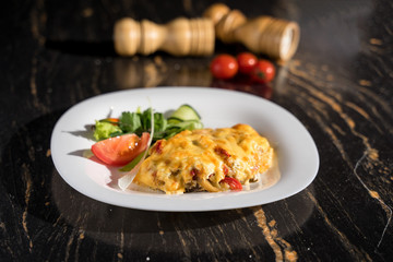 chicken chop, restaurant serving, garnished with fresh vegetables