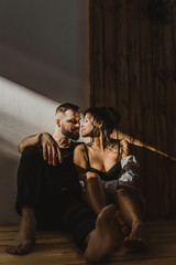 a man and woman in love in the sun on a black background. love happy relationships