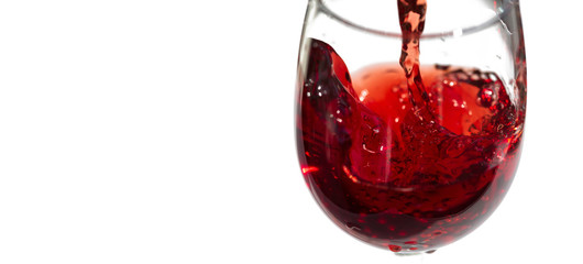 Pouring red wine. isolated on white. Save space, blur in fast motion.
