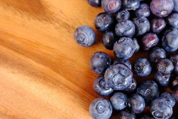 fresh blueberries on wooden table.  Texture blueberry berries. Copy space for your text. top view