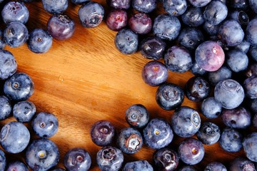 fresh blueberries in Wooden tray isolated on white background.