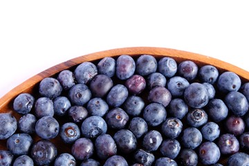 fresh blueberries on wood isolated on white background. Selective focus.