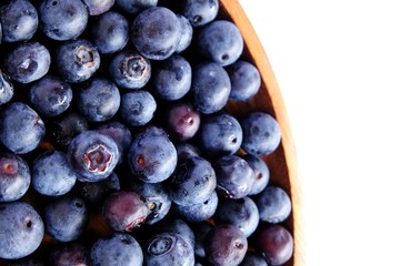 fresh blueberries on wood isolated on white background. Selective focus.