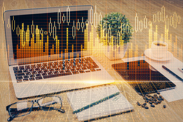 Multi exposure of graph and financial info and work space with computer background. Concept of...