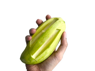 The peel light green mango holding in hand, isolated in white background. Tasty and healthy fruit...