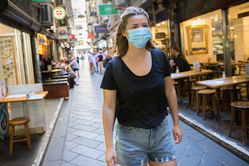 Female Tourist Wearing a Face Mask Exploring Melbourne