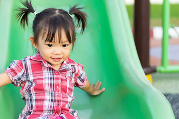 Portrait image of 1-2 yeas old baby. Happy Asian child girl smiling and laughing. She playing with...