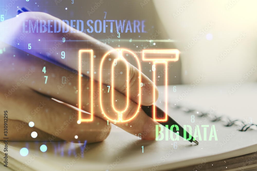 Poster creative iot hologram with man hand writing in notepad on background, internet of things concept. mu
