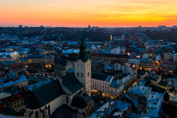 Obraz premium Aerial view of Latin cathedral and Rynok square in Lviv, Ukraine at sunset. View from Lviv town hall
