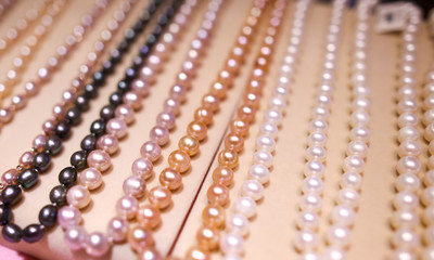 Fototapeta na wymiar Pearl beads on a counter