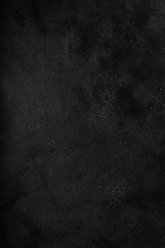 Dark moody black with grey concrete texture or background. With place for text and image