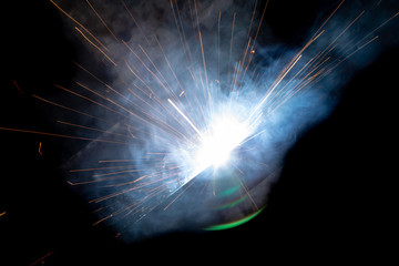 sparks from metal welding at a construction site