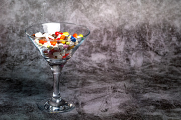 Medicine in a glass Martini glass.