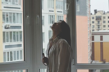 Attractive caucasian brunette girl at home, emotional portrait