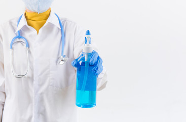 Doctor hands using washing hand with Alcohol Sanitizer and dust mask isolate on a white background. Protect themselves from virus infection in Corona virus crisis 2020