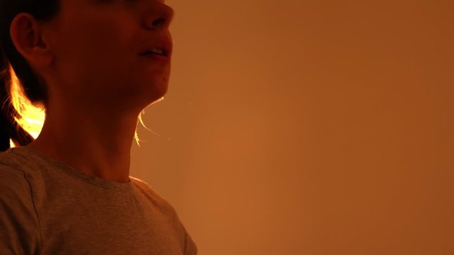 Portrait of young woman sneezing with drops of muscus. Dangerous germs. Covid-19