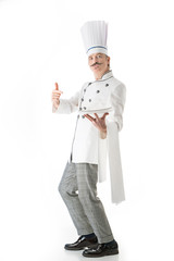 Chef cook posing with a white plate and a thumb up on a white background