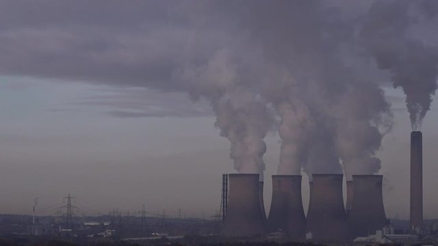 Industrial landscape in the north of England with chimneys and turbines UK 4K