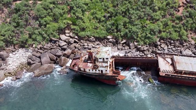 The rusty shipwreck run aground. Sri Lanka
