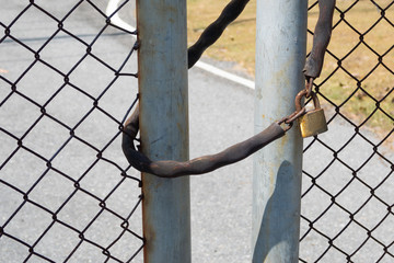 The door locked with Metal chain and padlock