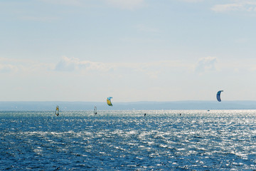  landscape of the Puck Bay in Poland with windsurfingfloating on the water