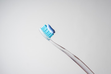 Toothpaste on a toothbrush. Toothbrush. Oral hygiene.