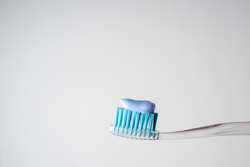 Toothpaste on a toothbrush. Toothbrush. Oral hygiene.