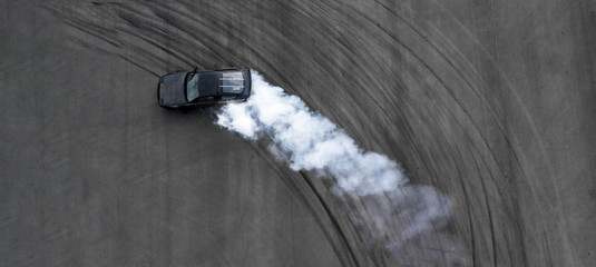 Aerial top view professional driver drifting black car on asphalt road track, Automobile and...