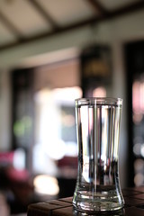 Glass of water on wood table background