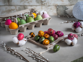 Multi-colored painted eggs, chicken and quail and Easter gingerbread cookies