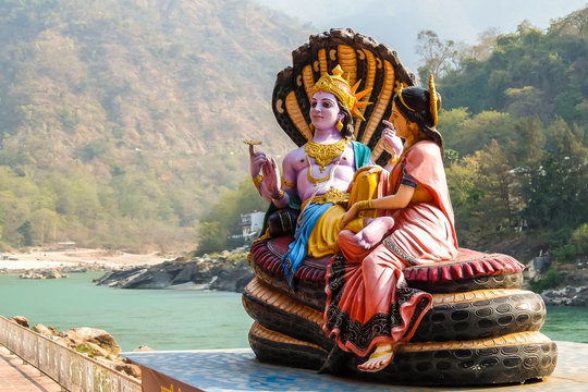 Rishikesh, India. Beautiful statues of Lord Vishnu and Lakshmi at the Ganga riverbank in Rishikesh.