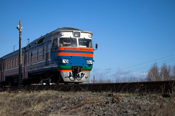A commuter train moves on rails.