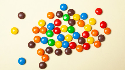 small multi-colored sweets. colorful candies top view.