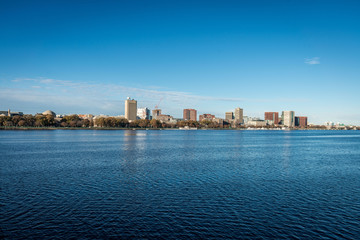 Boston cityscape with river in front in a sunny day