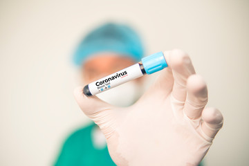 Coronavirus 2019-nCoV Blood Sample. Corona virus outbreaking. Corona Virus in Lab. Scientist hold a tube with Blood Test and Barcode with the Virus Name Coronavirus . New Epidemic Corona Virus