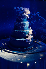 dark blue multi-tiered wedding cake in dark