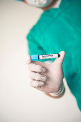 Coronavirus 2019-nCoV Blood Sample. Corona virus outbreaking. Corona Virus in Lab. Scientist hold a tube with Blood Test and Barcode with the Virus Name Coronavirus . New Epidemic Corona Virus