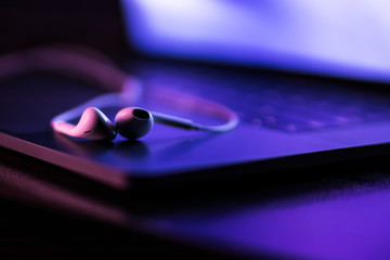 colorful close-up of handsfree on a laptop keyboard with super shallow depth of field