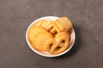 The homemade cookies are on the white plate